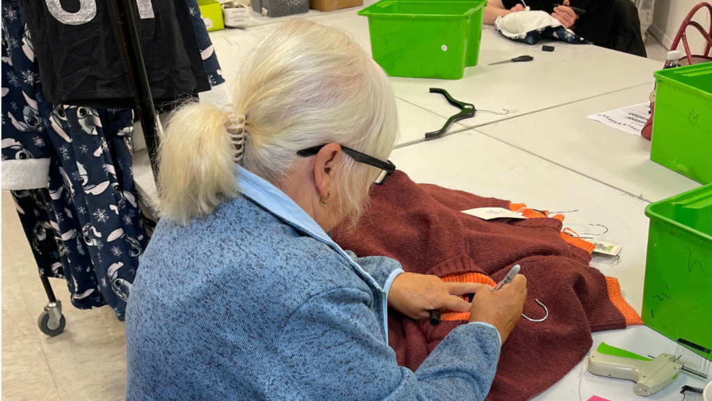 PIcture shows a volunteer working in the Newlife volunteer opportunities centre