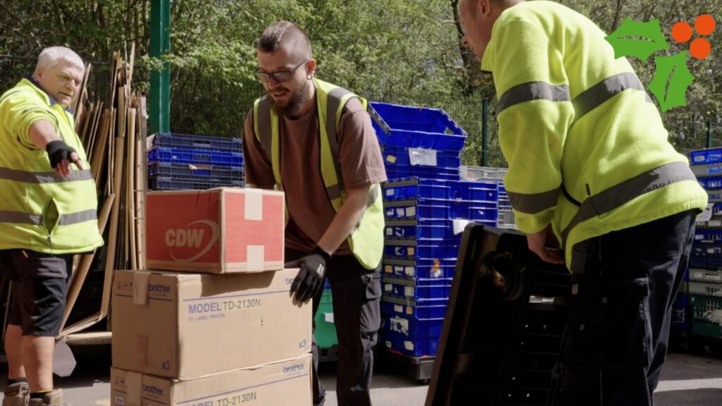 Picture shows warehouse volunteers unloading stock.